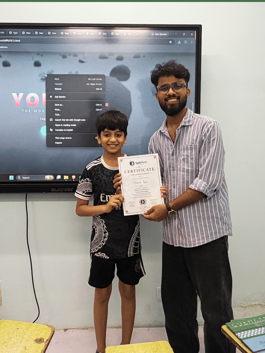 Student receiving their SpikiTech completion certificate.