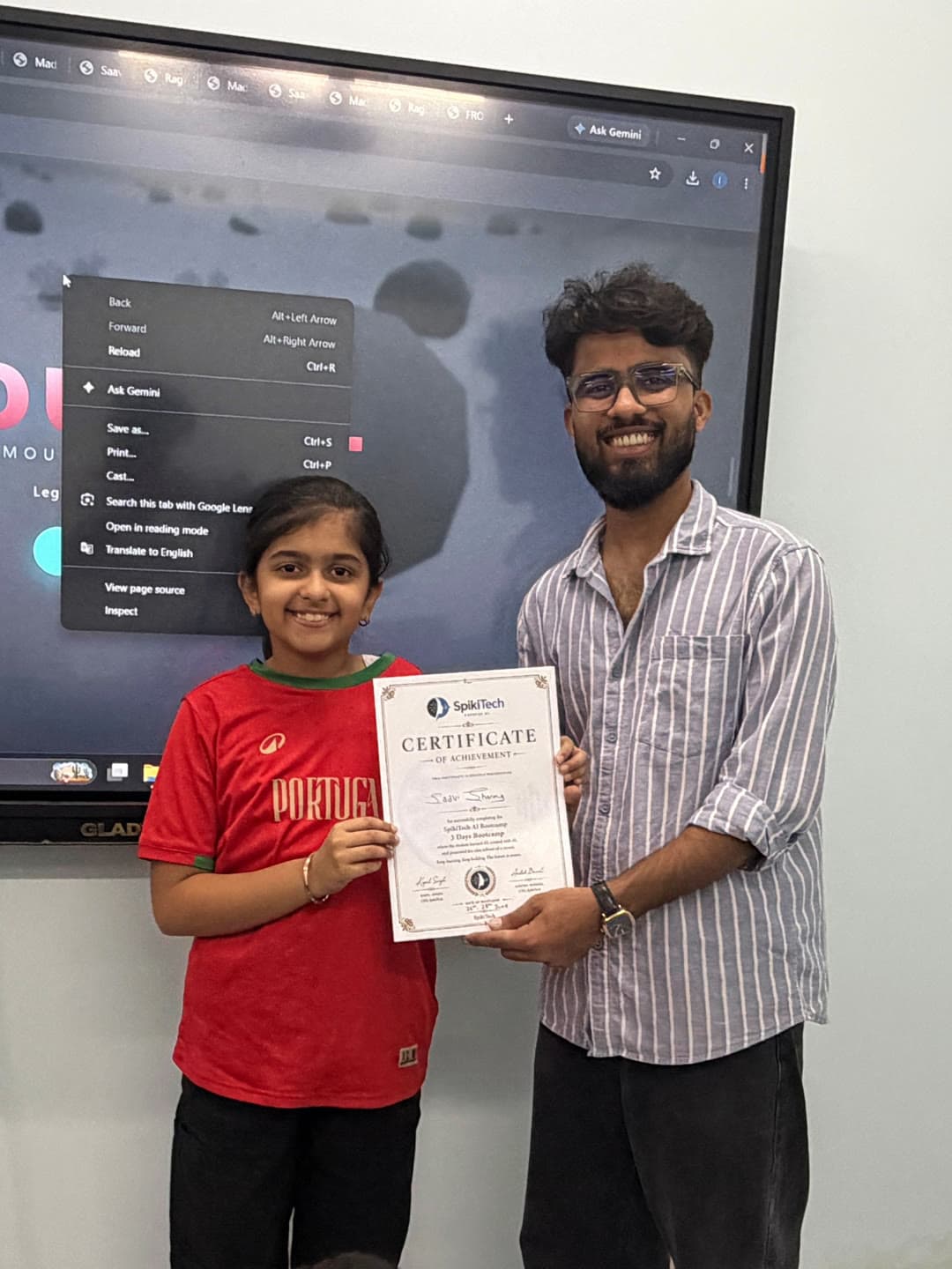 Student celebrating a SpikiTech certificate achievement.